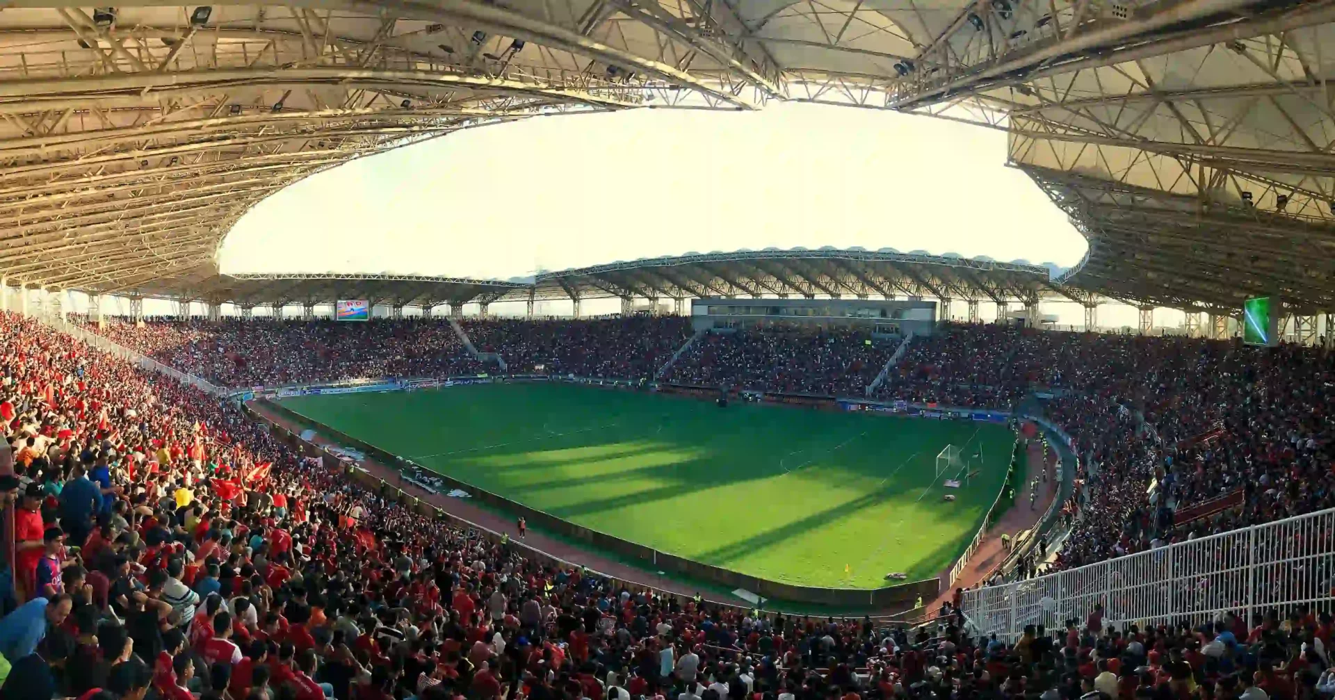 Football stadium full of people.